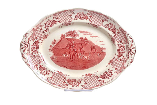 Decorative plate with red and white pattern on a white background