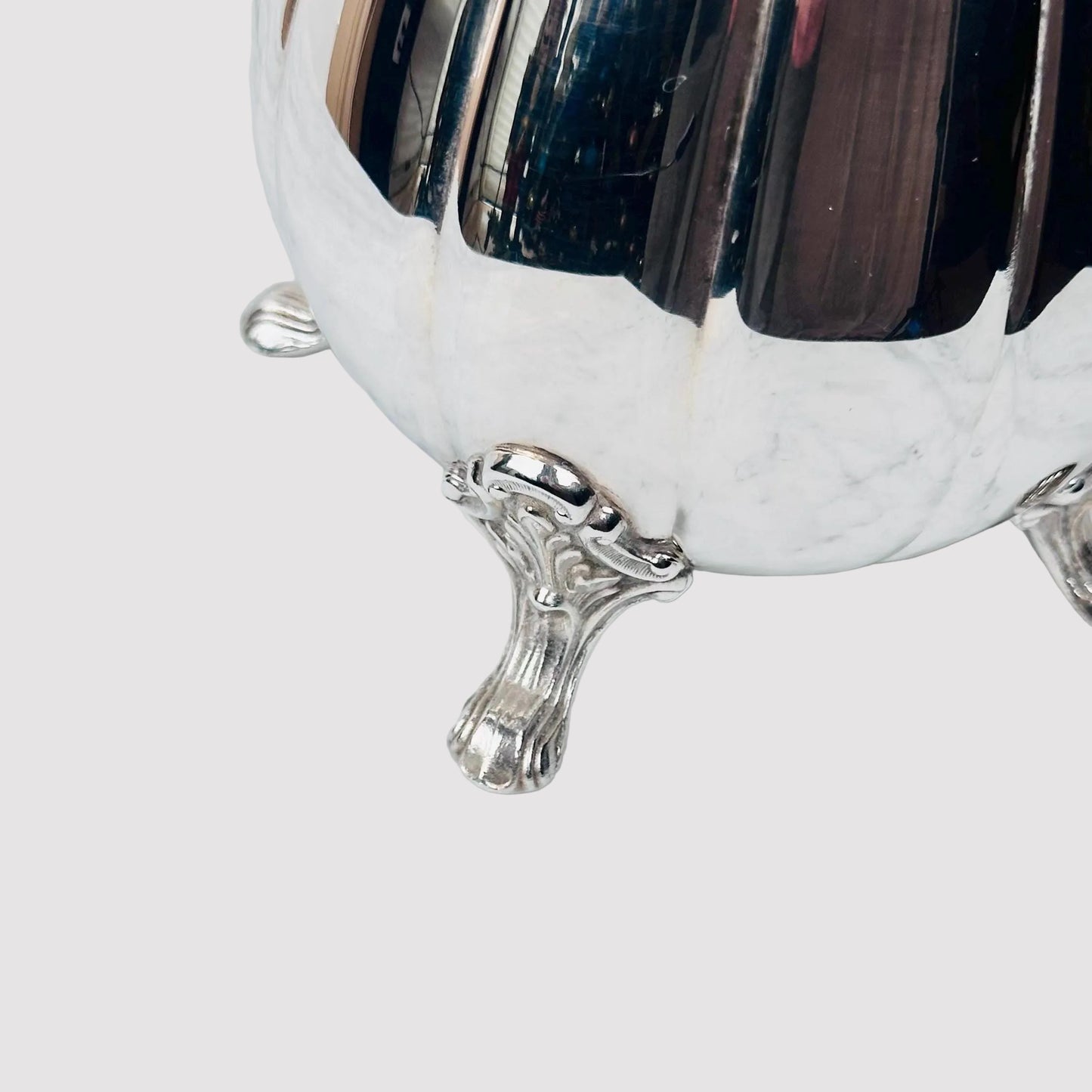 Silver footed bowl on a marble surface