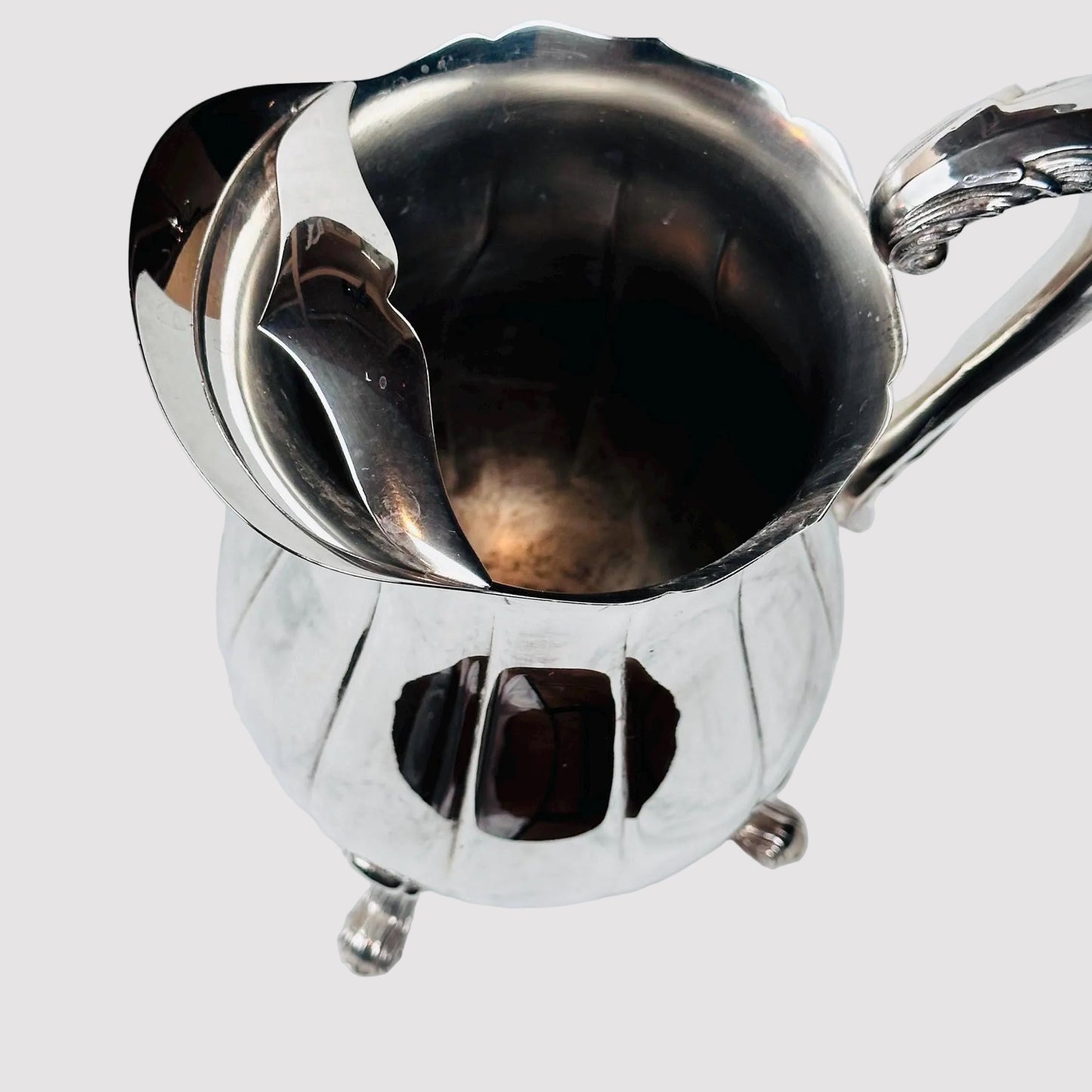 Metallic pitcher on a marble surface