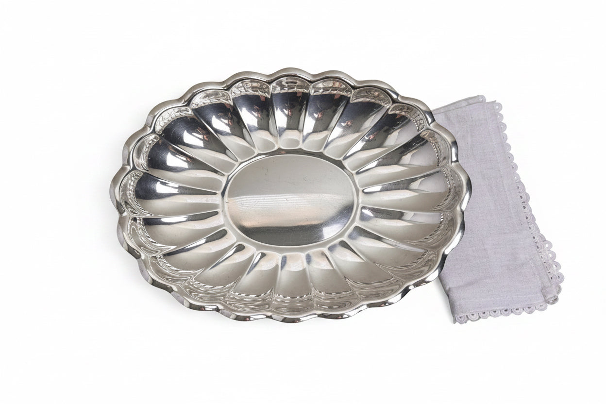 Silver decorative plate on a beige background